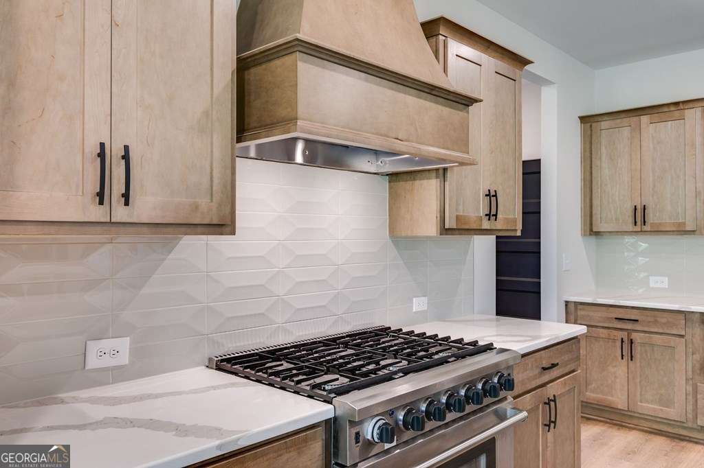 1593 Bethesda Church Road Carrollton, GA 30117 - Photo 26 of 48 a stove top oven sitting inside of a kitchen