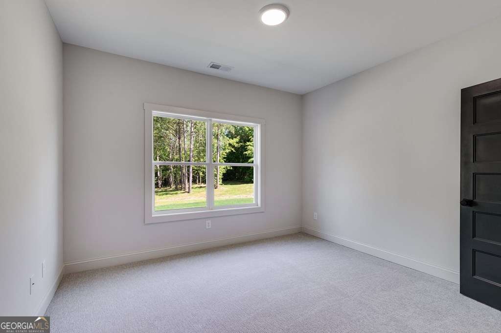 1593 Bethesda Church Road Carrollton, GA 30117 - Photo 29 of 48 an empty room with a window