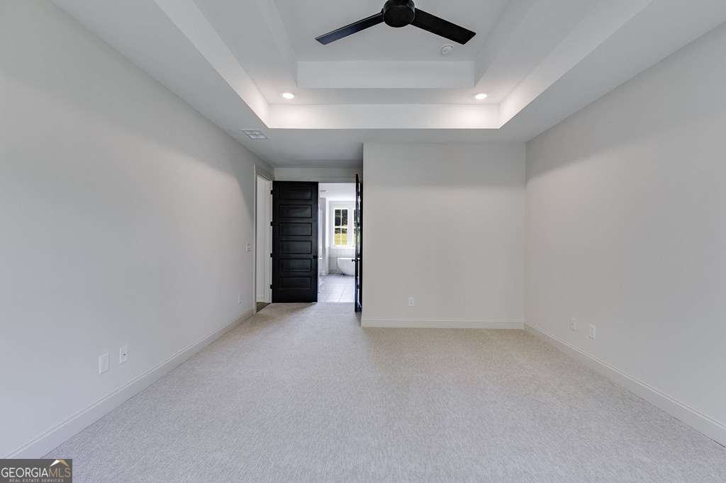 1593 Bethesda Church Road Carrollton, GA 30117 - Photo 31 of 48 an empty room with ceiling fan and window
