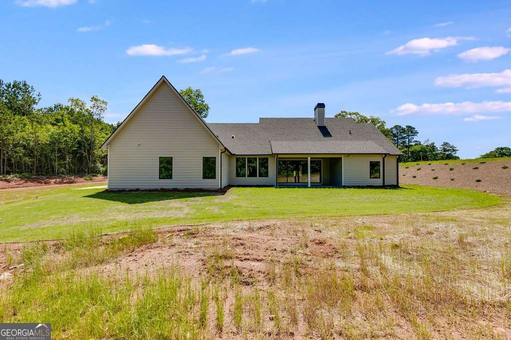 1593 Bethesda Church Road Carrollton, GA 30117 - Photo 42 of 48 a view of a house with a yard
