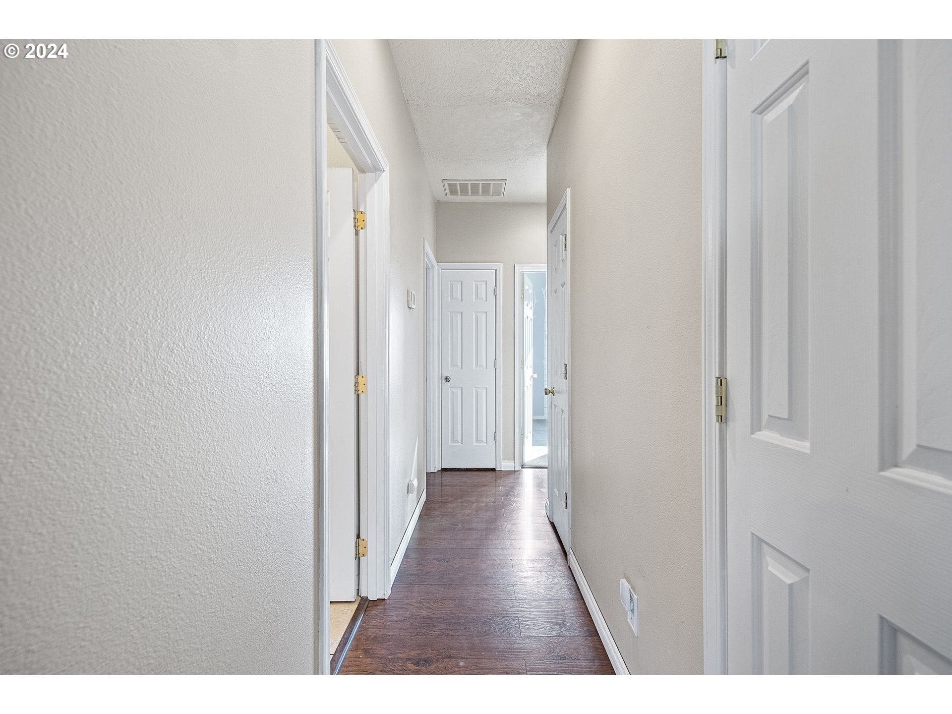 1529 South 59th Street Springfield, OR 97478 - Photo 19 of 38 a view of a hallway with wooden floor