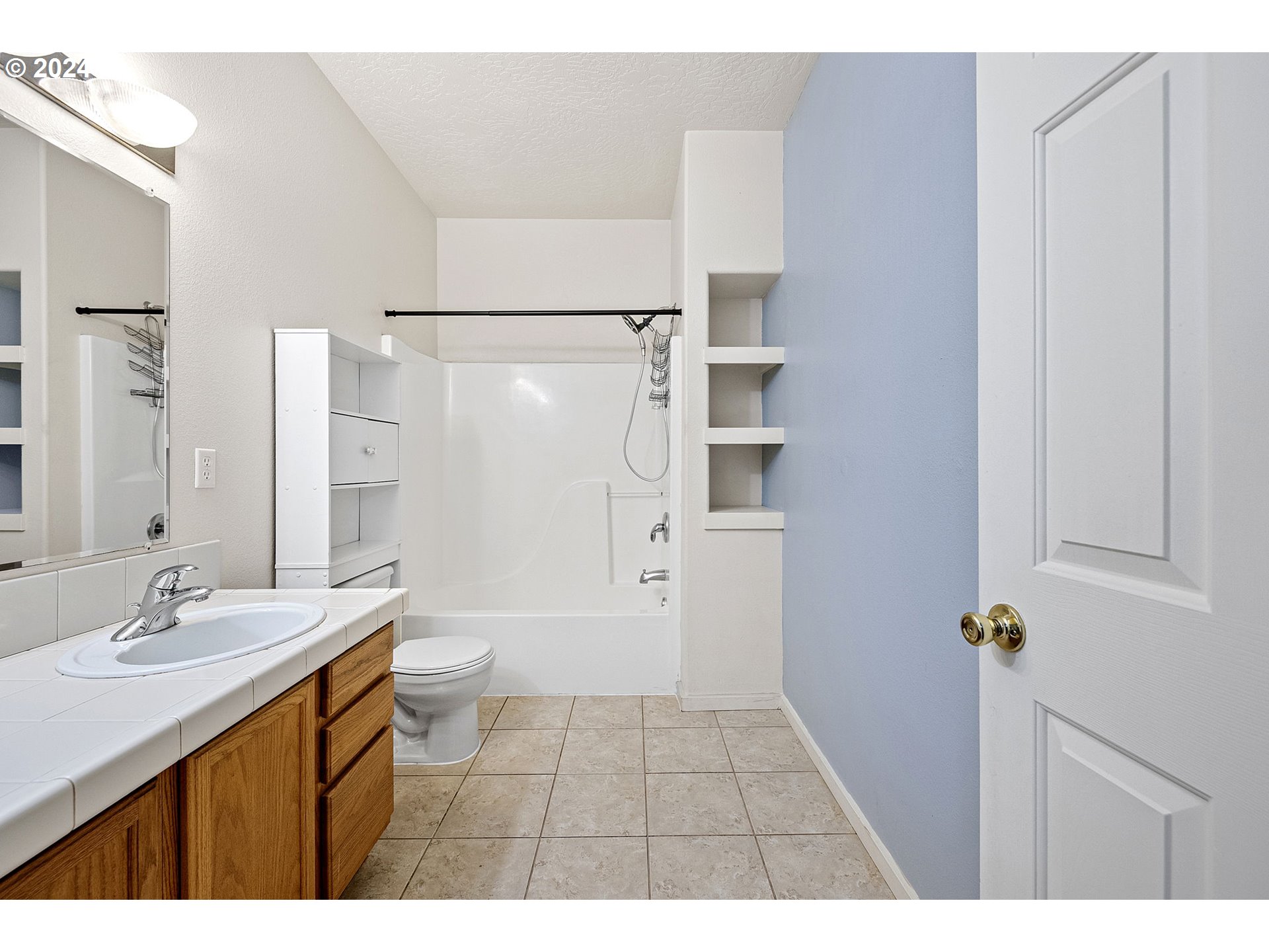 1529 South 59th Street Springfield, OR 97478 - Photo 22 of 38 a bathroom with a sink a toilet and shower