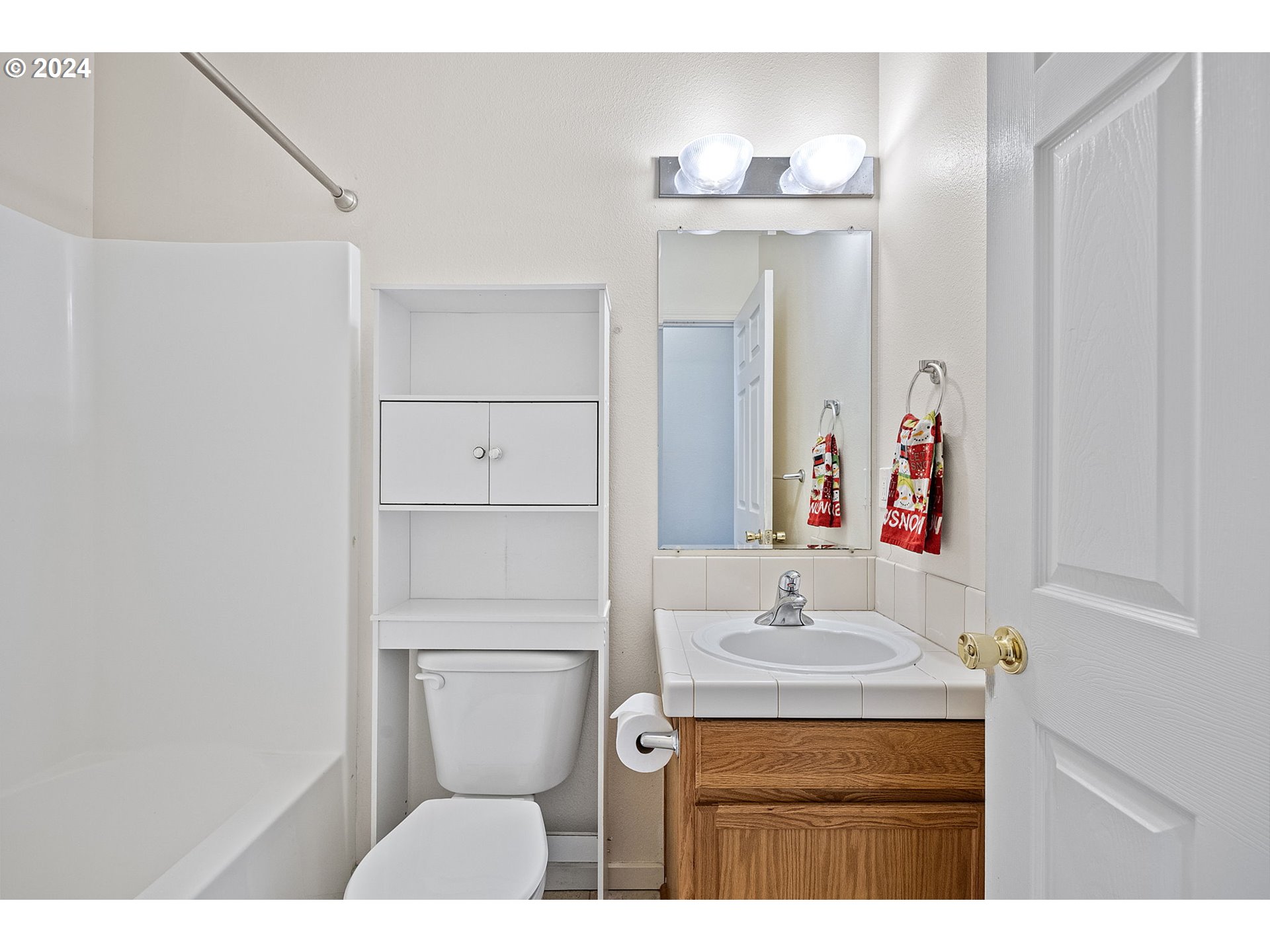 1529 South 59th Street Springfield, OR 97478 - Photo 27 of 38 a bathroom with a sink vanity toilet and mirror
