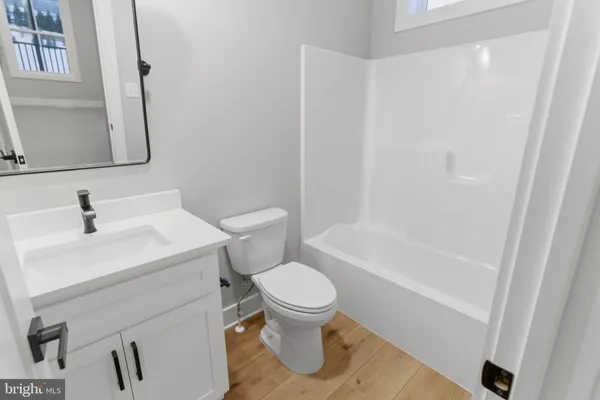 a view of a balcony with wooden floor and stairs