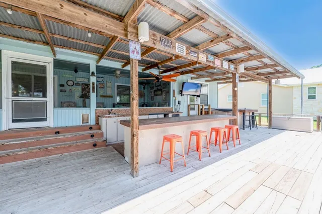 a view of a swimming pool with a outdoor seating