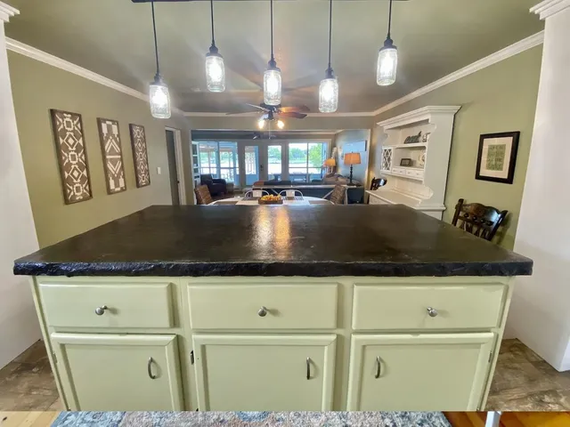 a view of a refrigerator a sink and dishwasher