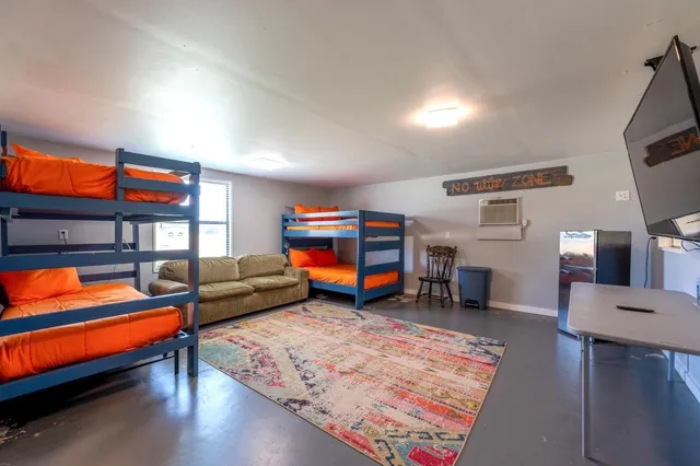 a living room with furniture and a rug