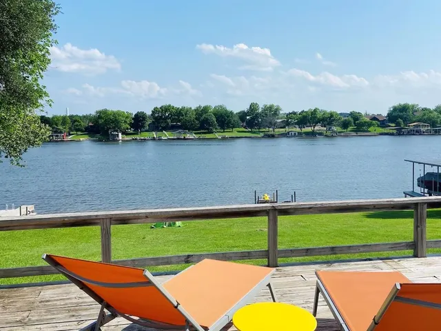 a view of a lake with a table and a lake view