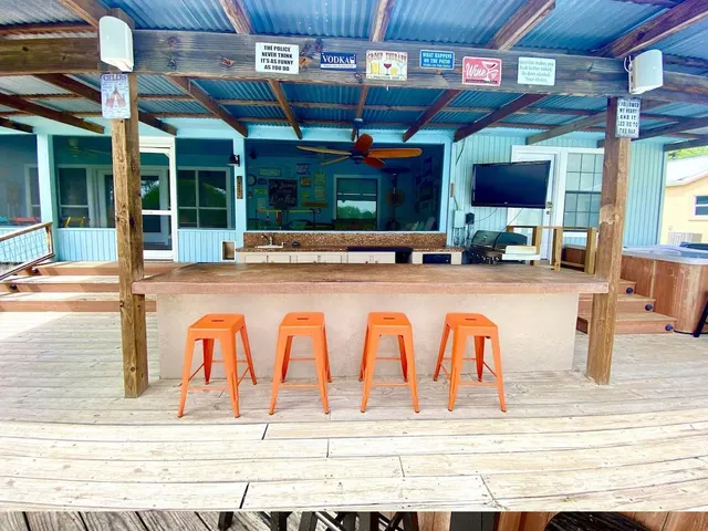 a view of a kitchen with furniture and flat screen tv