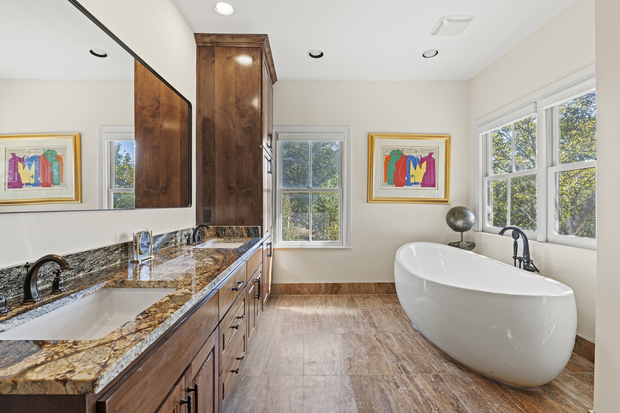 5801 Mount Gainor Road Wimberley, TX 78676 - Photo 19 of 40 a bathroom with a granite countertop tub a sink and a large window