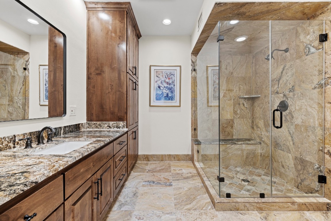 5801 Mount Gainor Road Wimberley, TX 78676 - Photo 23 of 40 Full bathroom with vanity, marble tiled flooring, a stall shower, and recessed lighting