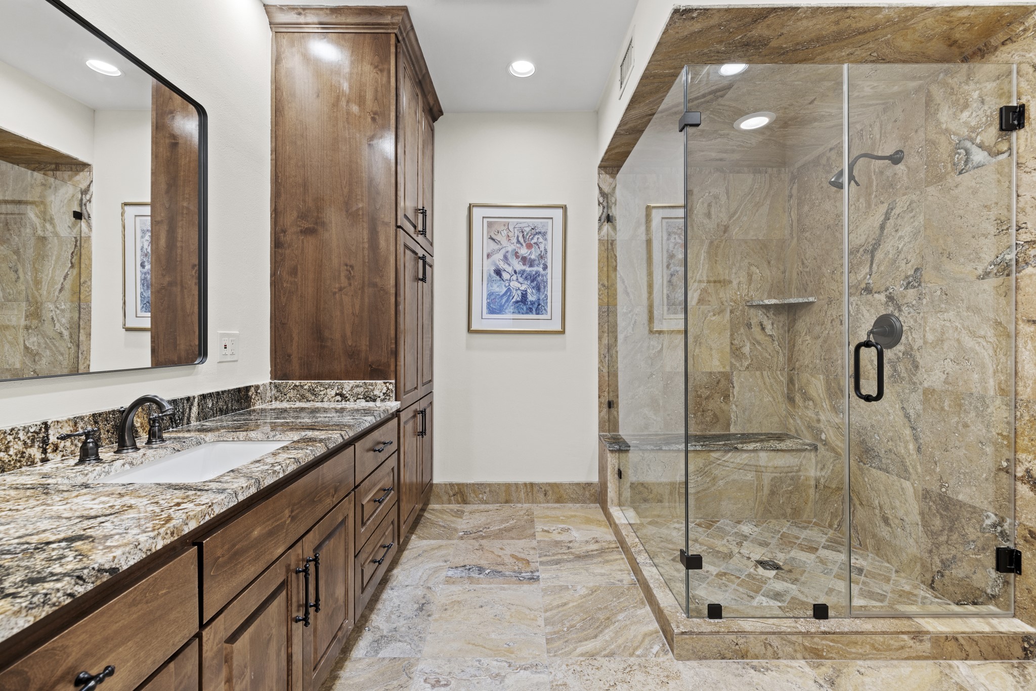 5801 Mount Gainor Road Wimberley, TX 78676 - Photo 23 of 40 a bathroom with a granite countertop sink a mirror and a shower