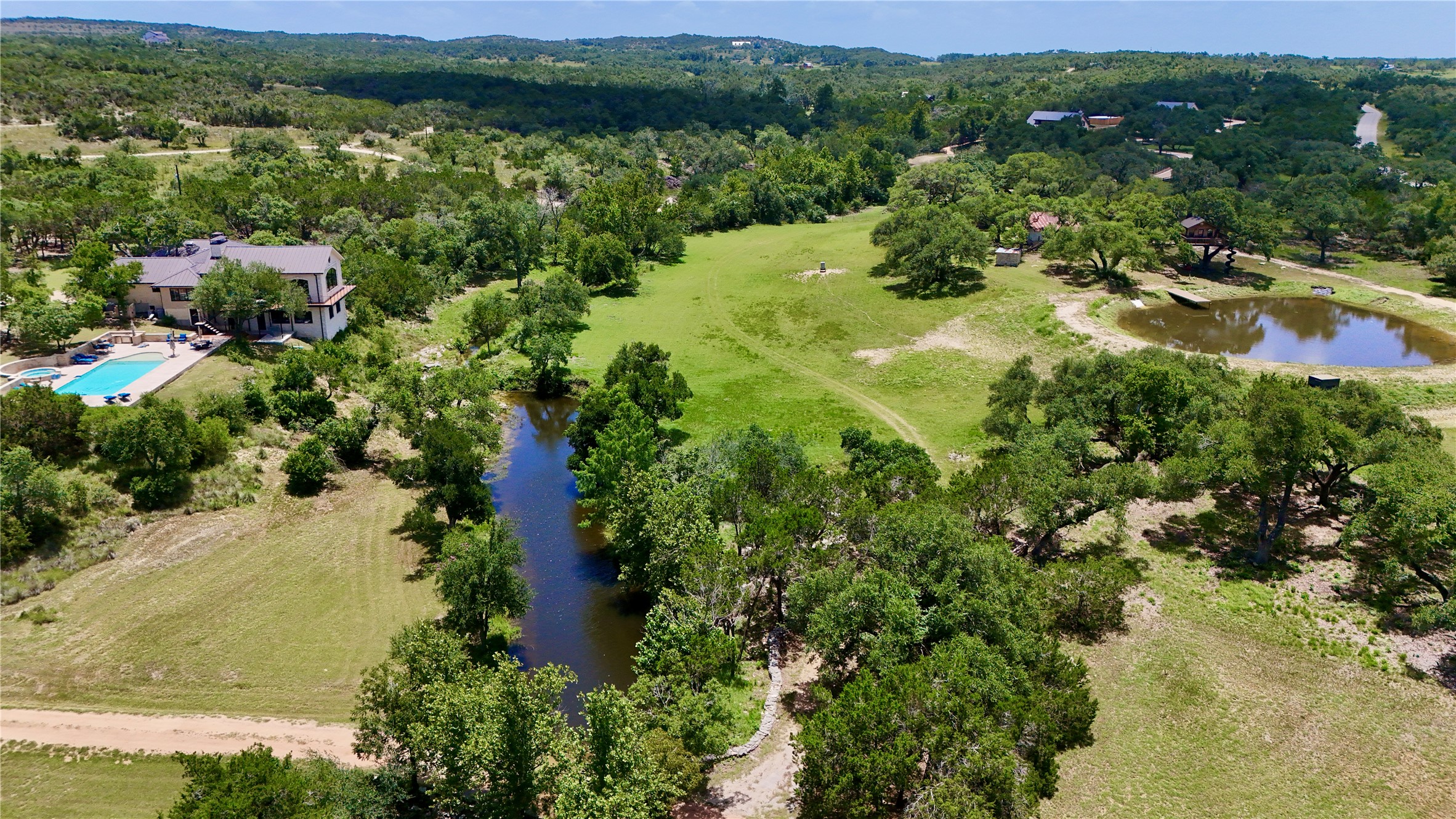 5801 Mount Gainor Road Wimberley, TX 78676 - Photo 3 of 40 an aerial view of residential house with outdoor space and trees all around