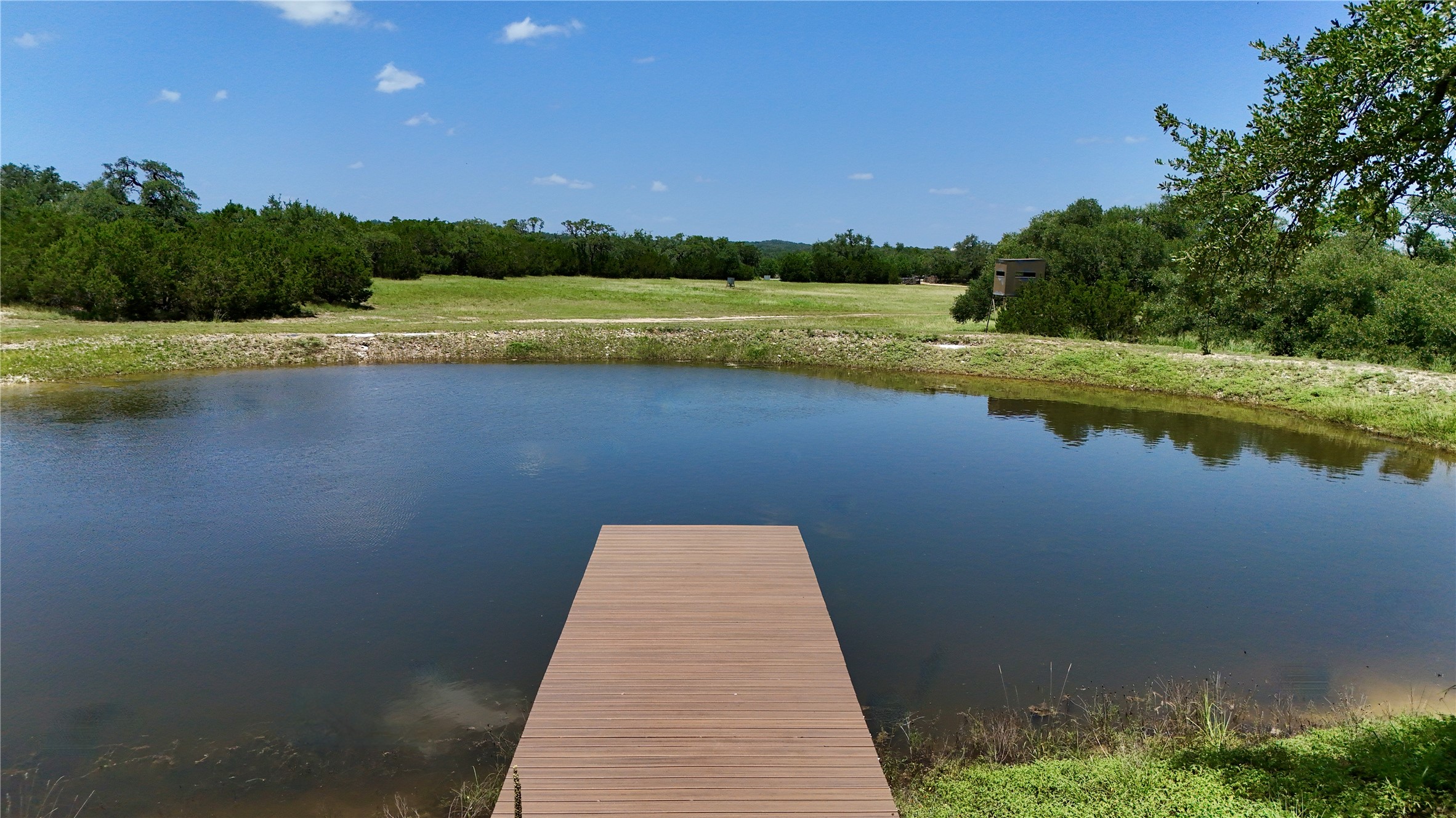 5801 Mount Gainor Road Wimberley, TX 78676 - Photo 34 of 40 a view of a lake with a big yard
