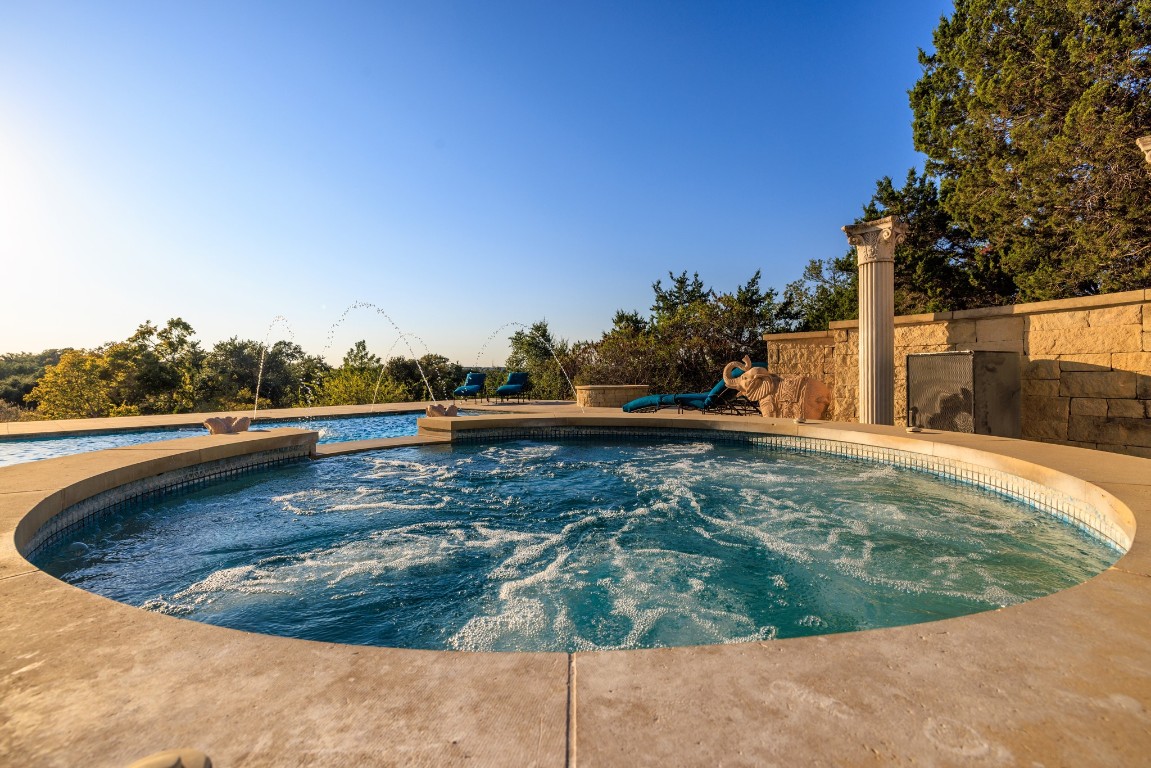 5801 Mount Gainor Road Wimberley, TX 78676 - Photo 40 of 40 Outdoor pool with an in-ground hot tub