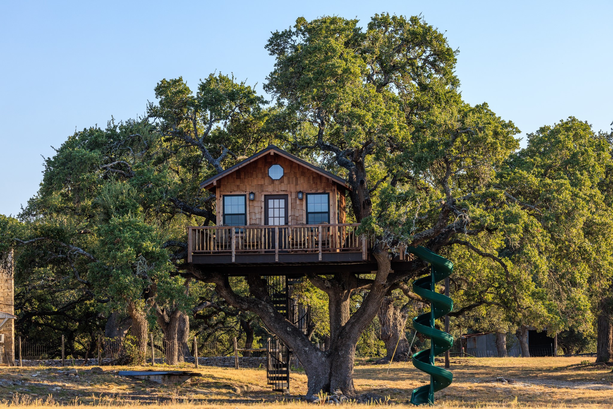 5801 Mount Gainor Road Wimberley, TX 78676 - Photo 5 of 40 a front view of a house with a yard
