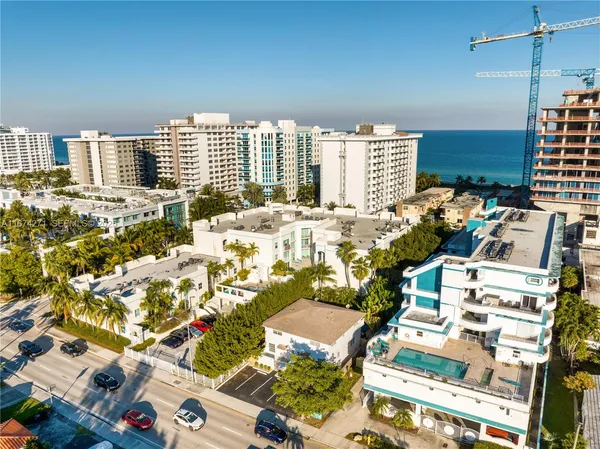 an aerial view of residential building with parking space