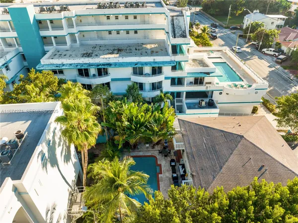 a view of a swimming pool with a patio