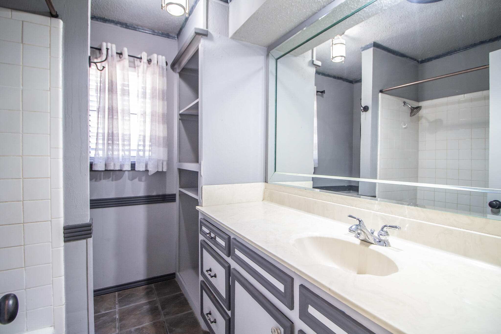 3401 89th Street Lubbock, TX 79423 - Photo 14 of 16 Shared Bathroom