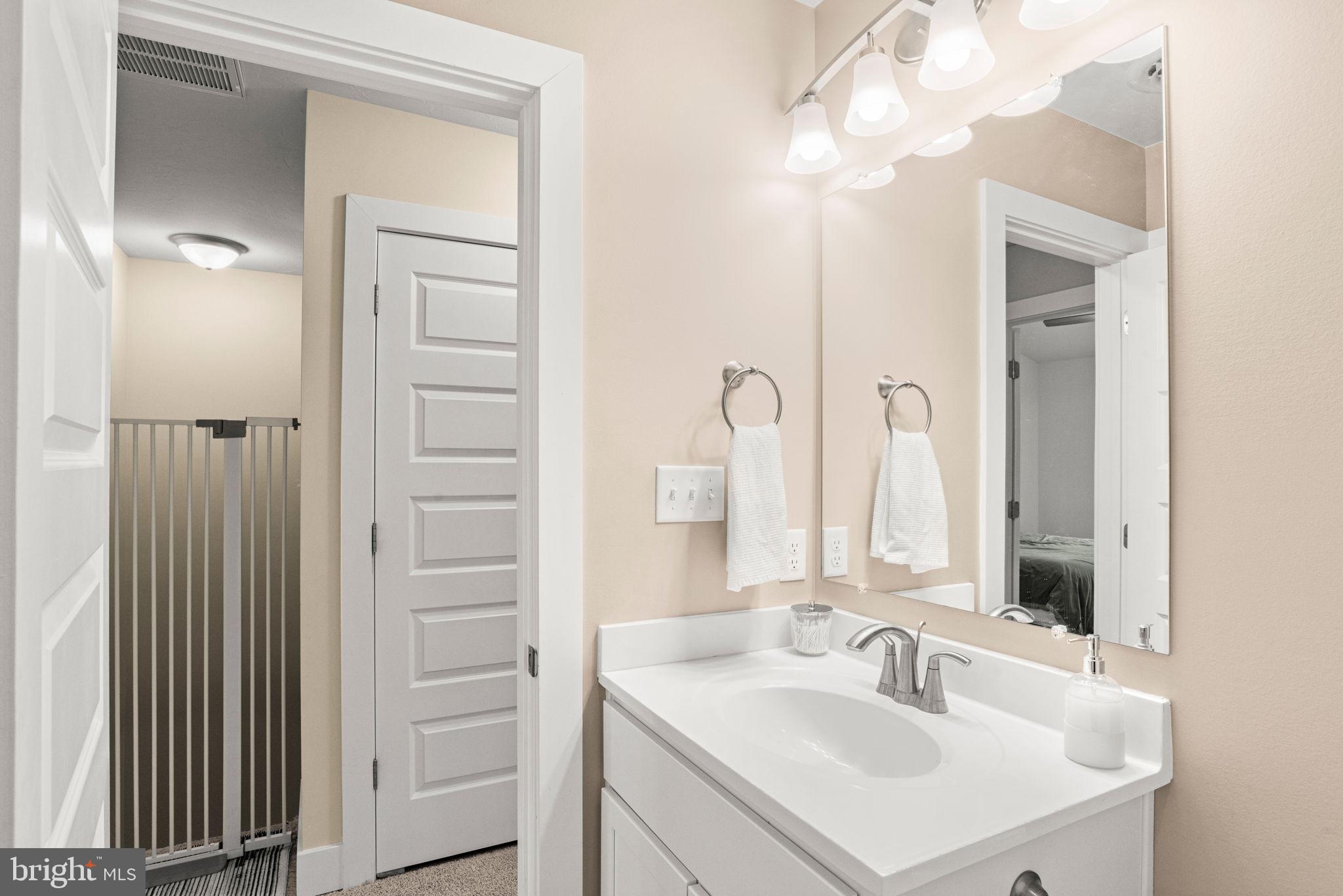 8796 Hillside Way Waynesboro, PA 17268 - Photo 23 of 31 a bathroom with a sink vanity and mirror