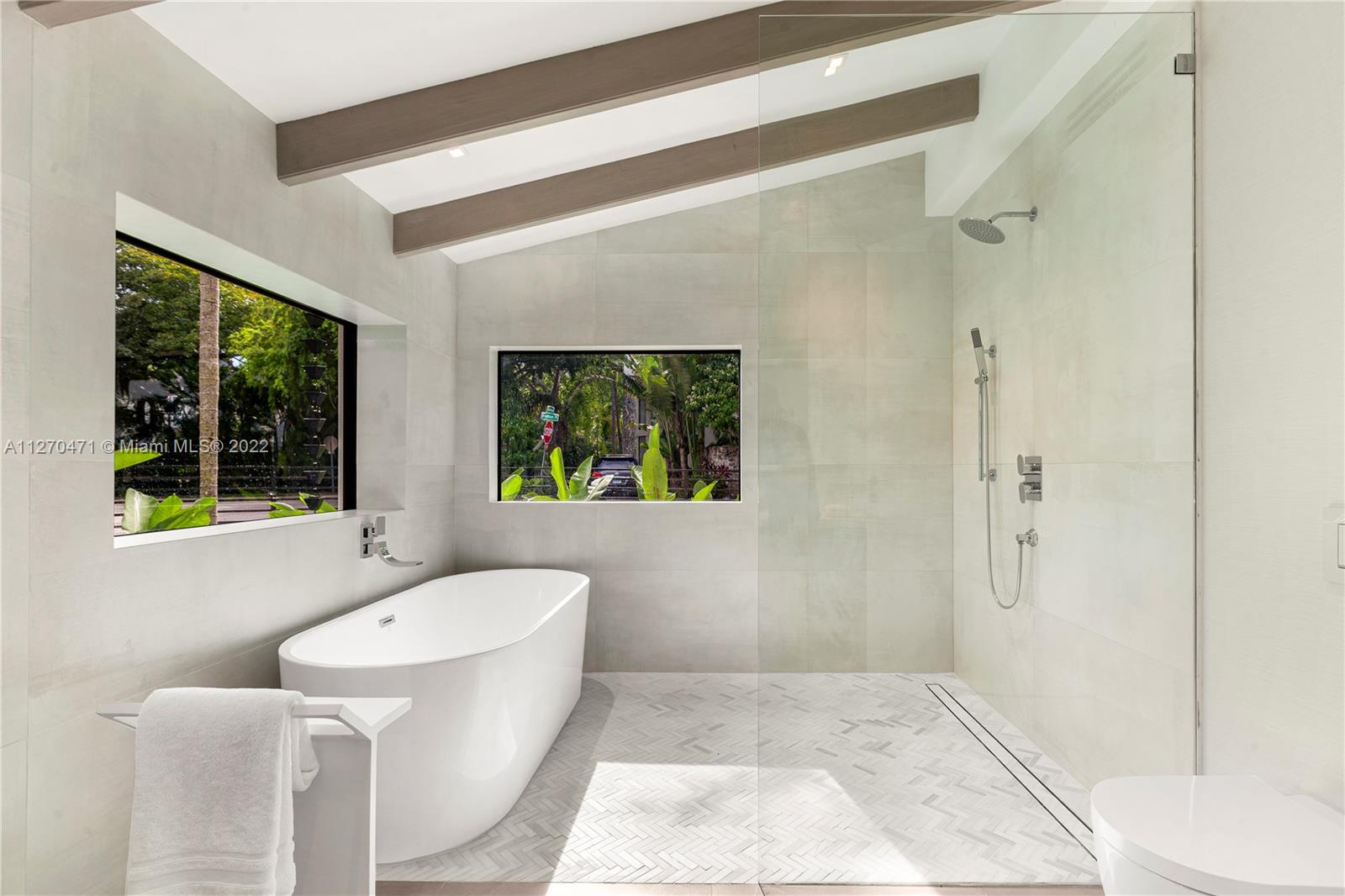 4095 Battersea Road Miami, FL 33133 - Photo 14 of 40 a bathroom with a sink and bathtub