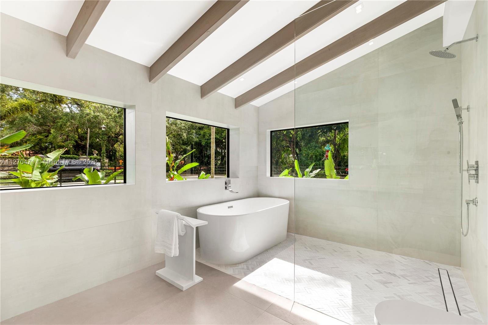 4095 Battersea Road Miami, FL 33133 - Photo 16 of 40 a living room with a couch and a large window