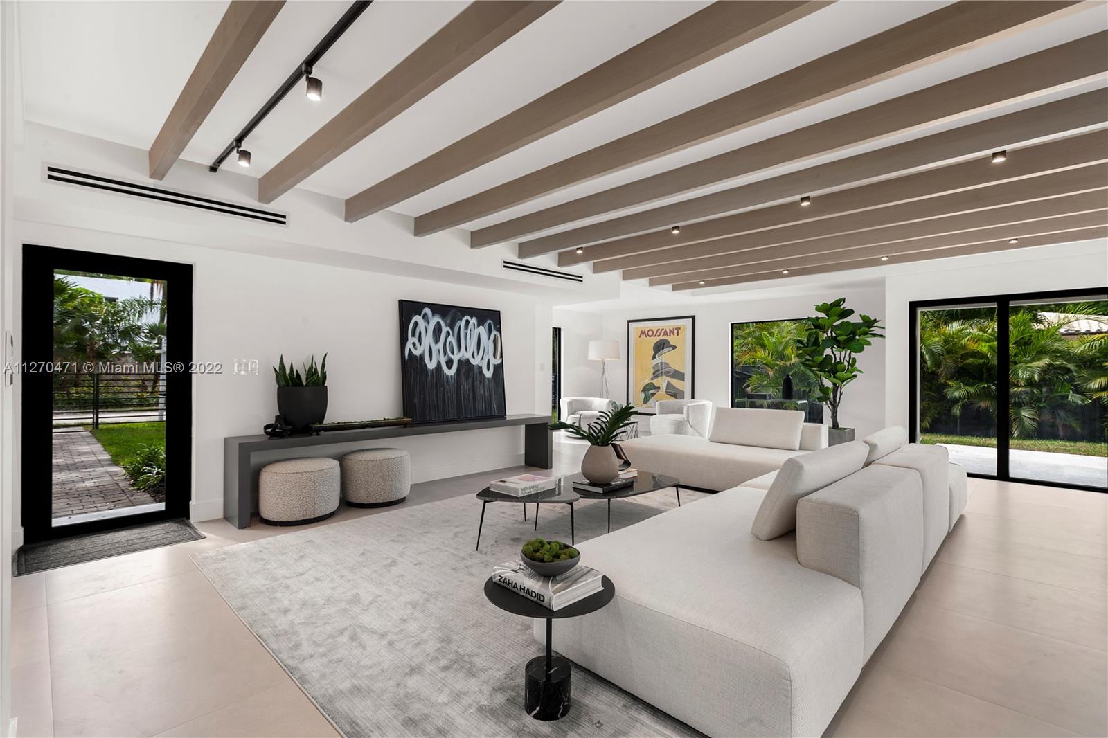 4095 Battersea Road Miami, FL 33133 - Photo 2 of 40 a living room with furniture and a potted plant