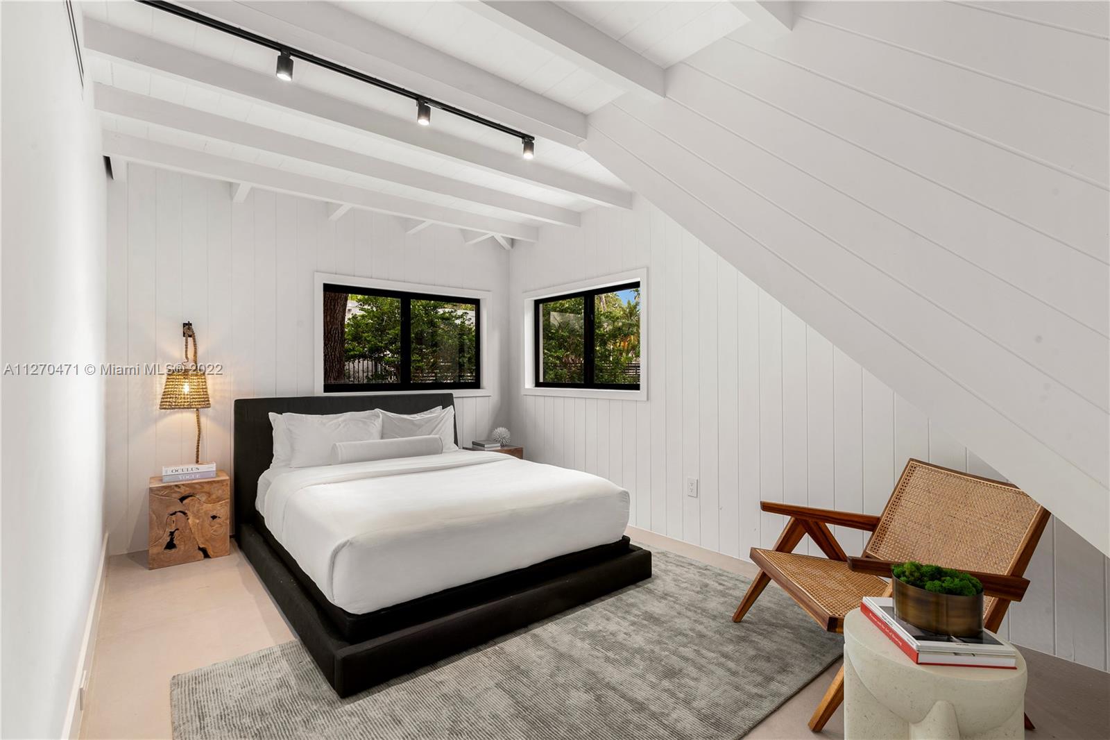 4095 Battersea Road Miami, FL 33133 - Photo 22 of 40 a bedroom with a bed and chair