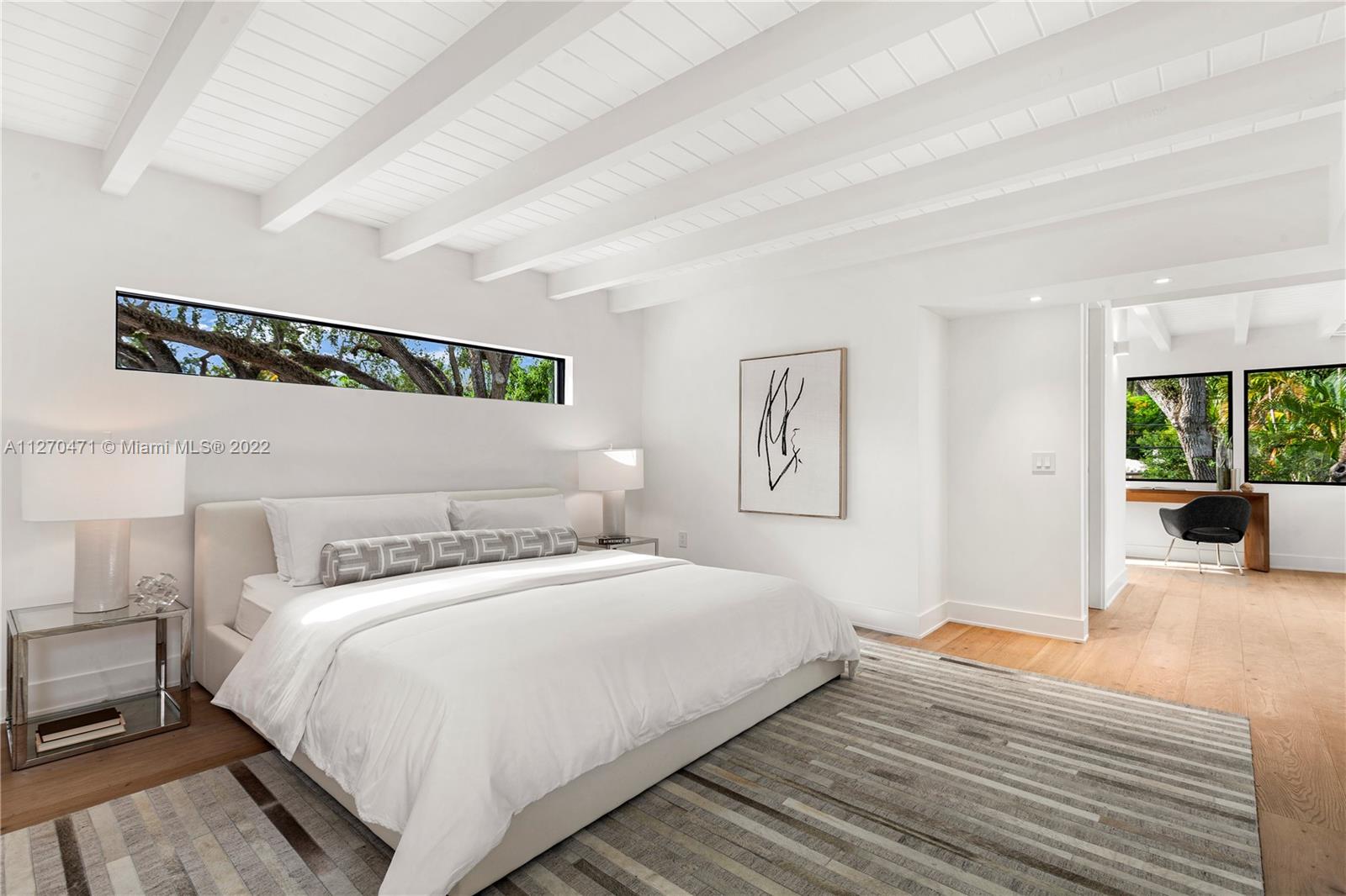 4095 Battersea Road Miami, FL 33133 - Photo 23 of 40 a bedroom with a bed and a view of living room