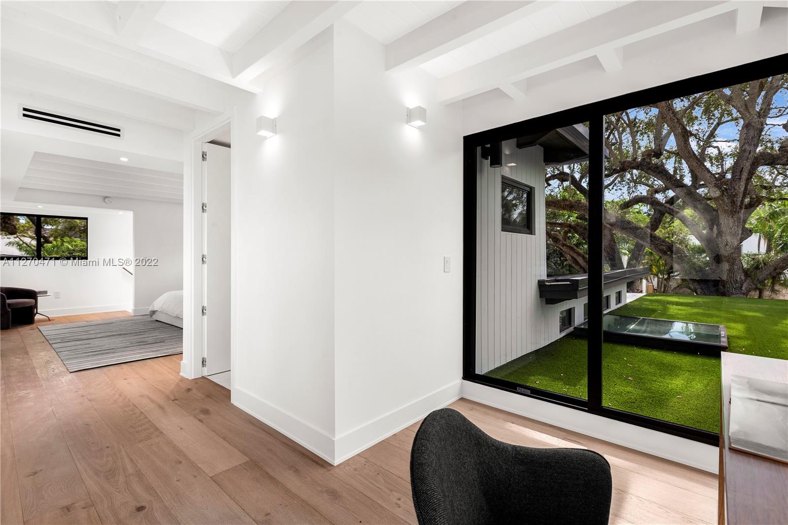 4095 Battersea Road Miami, FL 33133 - Photo 26 of 40 a view of hallway with livingroom and furniture