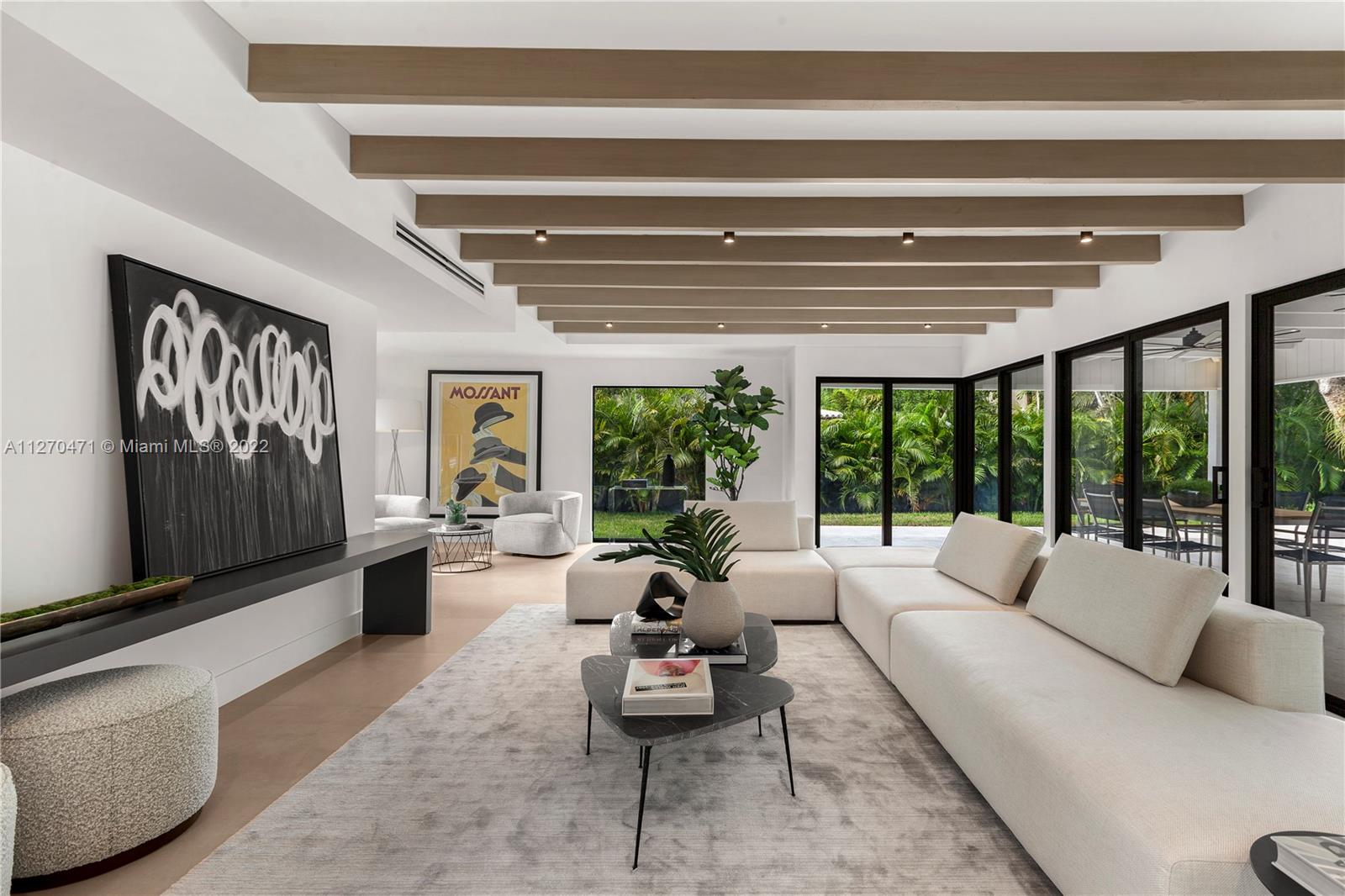 4095 Battersea Road Miami, FL 33133 - Photo 3 of 40 a living room with furniture and a large window