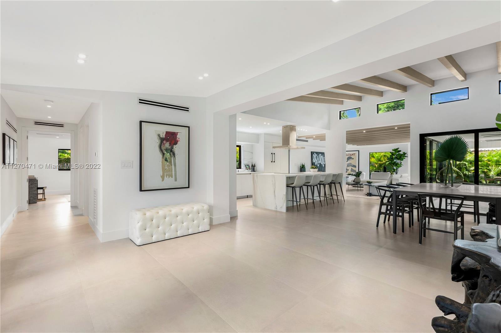 4095 Battersea Road Miami, FL 33133 - Photo 31 of 40 a living room with furniture and a table