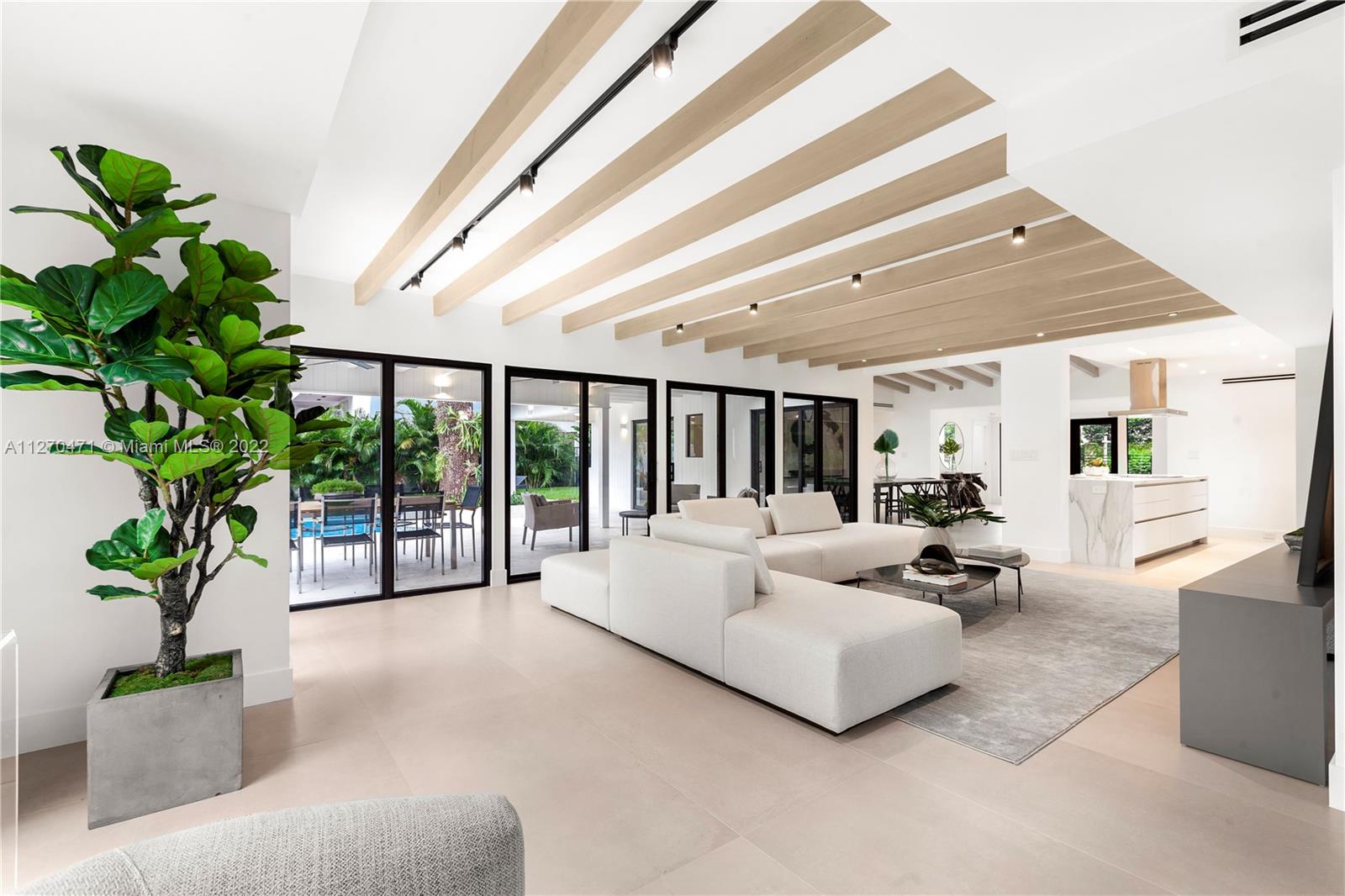 4095 Battersea Road Miami, FL 33133 - Photo 5 of 40 a living room with furniture and a potted plant