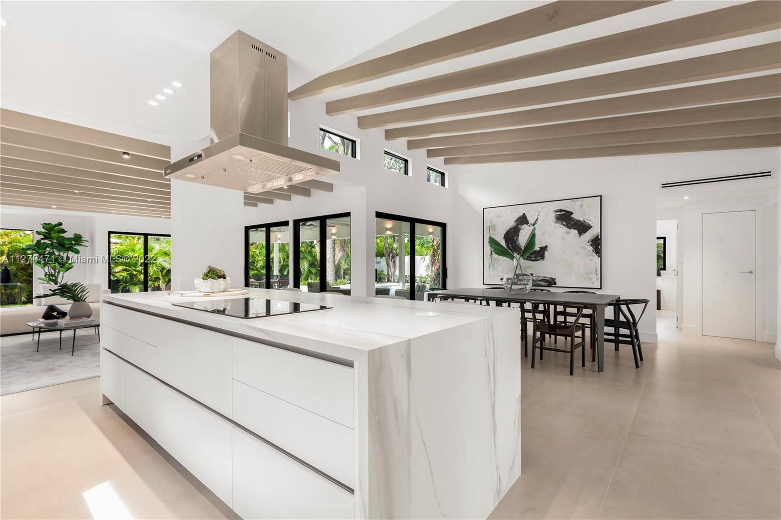 4095 Battersea Road Miami, FL 33133 - Photo 7 of 40 a dining hall with stainless steel appliances granite countertop furniture and a large window