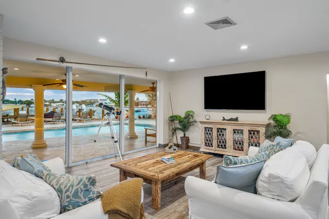 a view of a patio with swimming pool table and chairs
