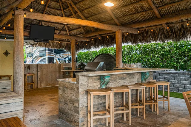 a view of a backyard with sitting area