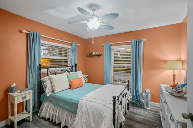 a bedroom with furniture and a window