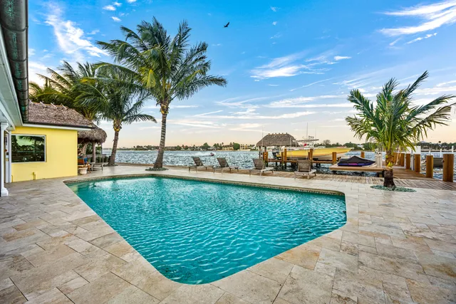 a living room with fireplace furniture and a flat screen tv