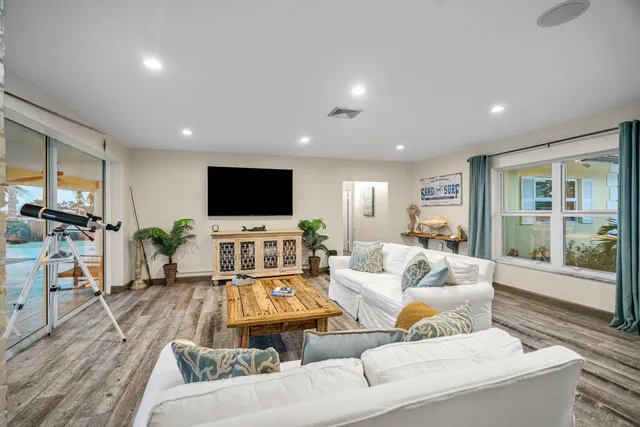 a living room with fireplace furniture and a flat screen tv