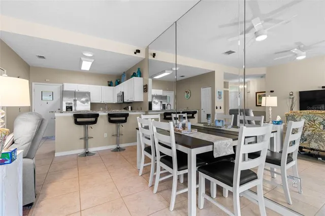a kitchen with stainless steel appliances a sink a stove and cabinets