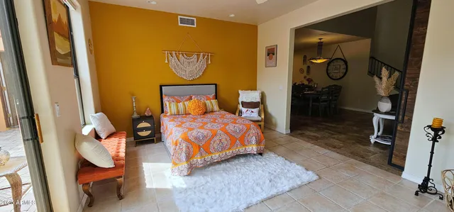 a bedroom with a bed and dresser