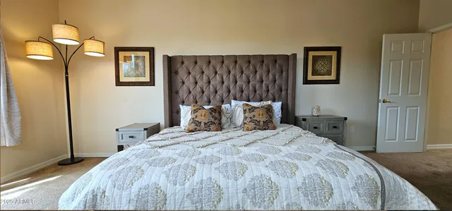 a bedroom with a bed and a cabinets