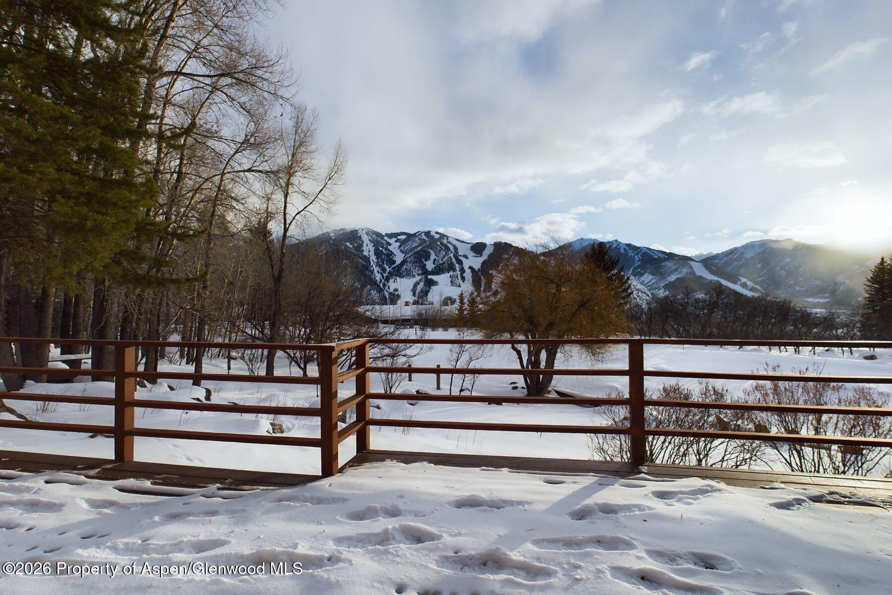 209 East Reds Road Aspen, CO 81612 - Photo 17 of 54 a view of a bench in front of house