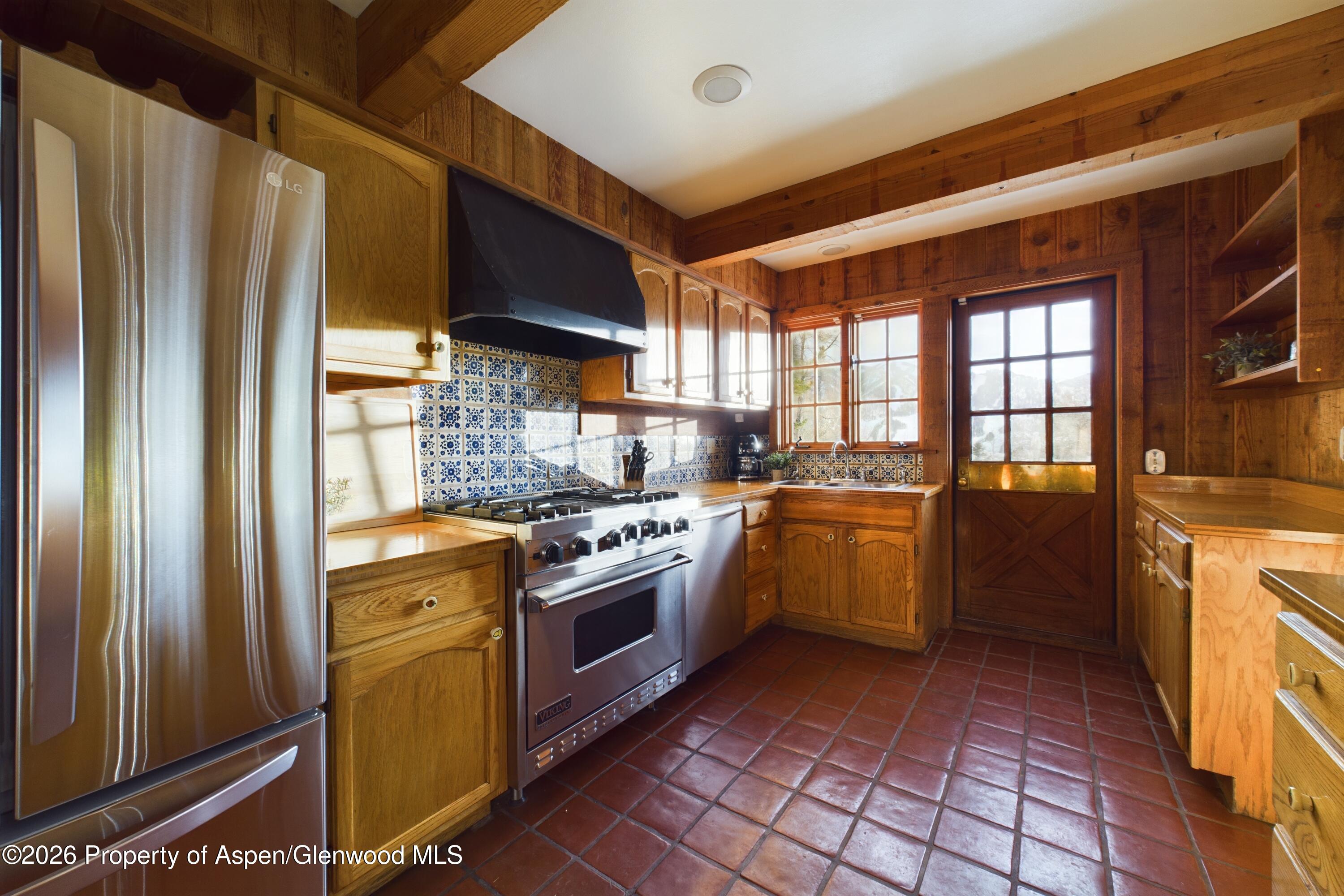 209 East Reds Road Aspen, CO 81612 - Photo 30 of 54 a kitchen with a sink stove and refrigerator