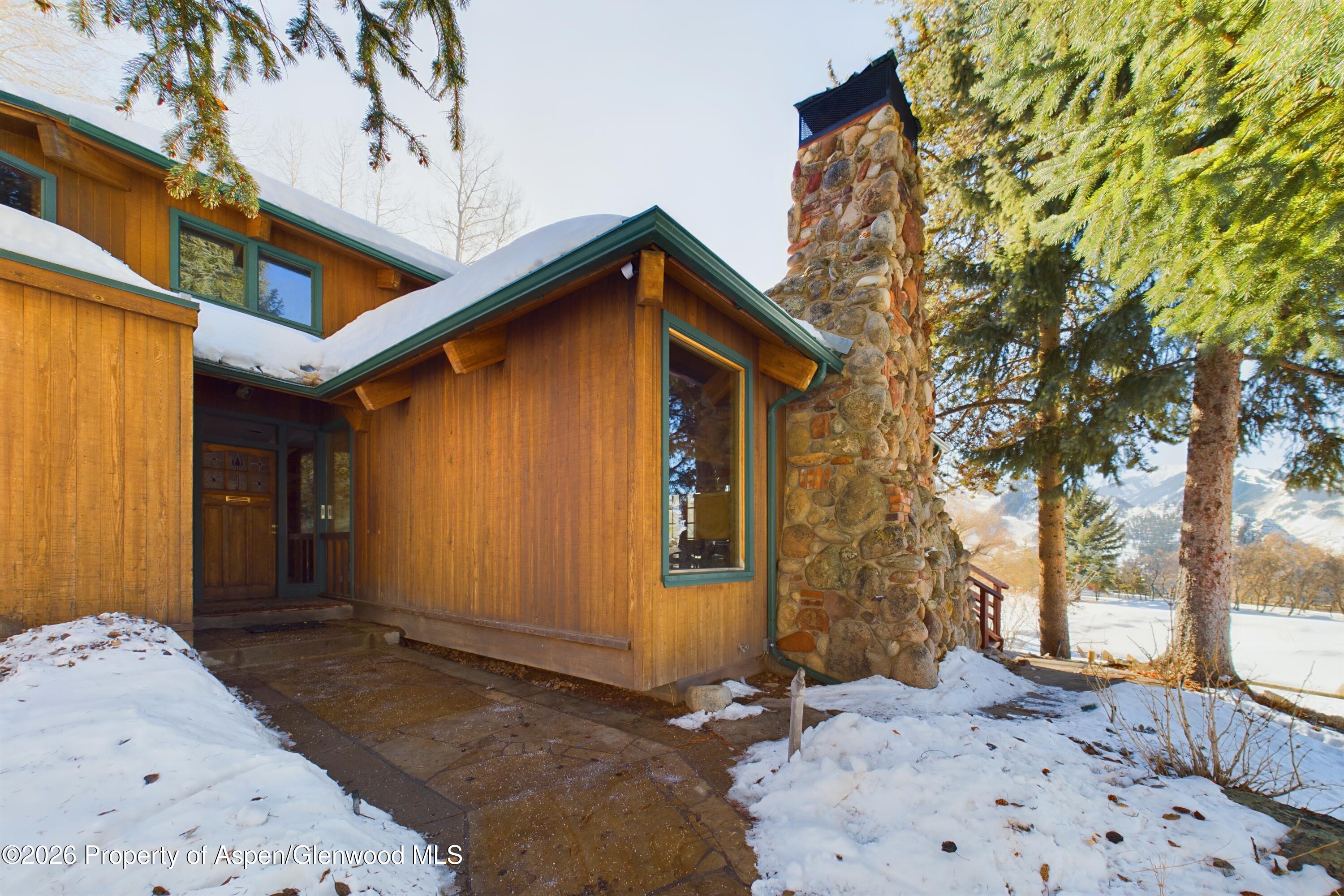 209 East Reds Road Aspen, CO 81612 - Photo 54 of 54 a front view of a house with a yard