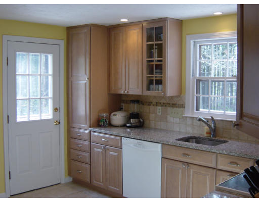 3 Harvard Road Framingham, MA 01701 - Photo 5 of 12 a kitchen with stainless steel appliances granite countertop a sink and cabinets