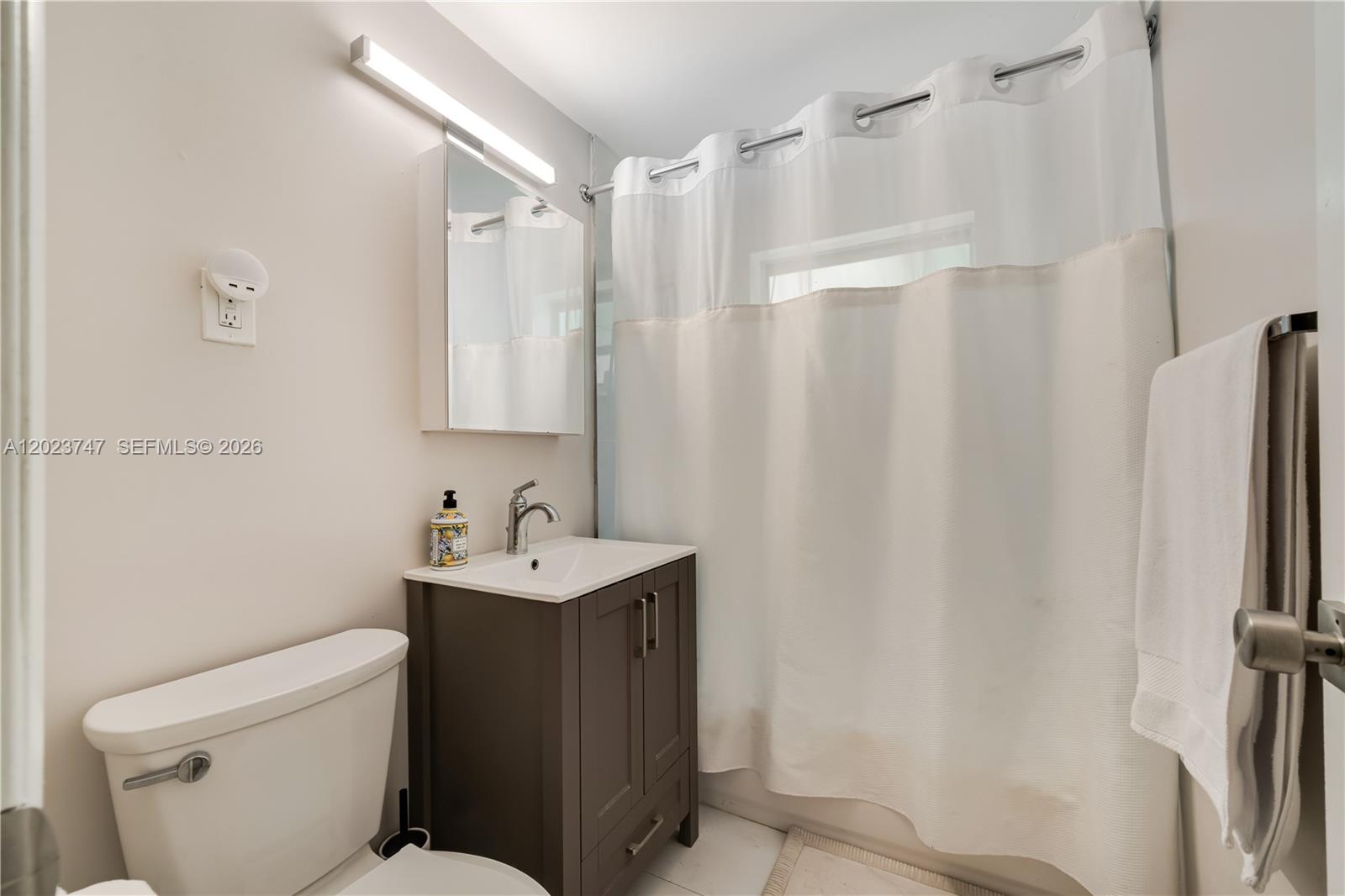 11515 Southwest 81st Road, Unit 11515 Pinecrest, FL 33156 - Photo 23 of 33 a bathroom with a sink a toilet and shower