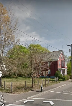 a view of a big building in a big yard