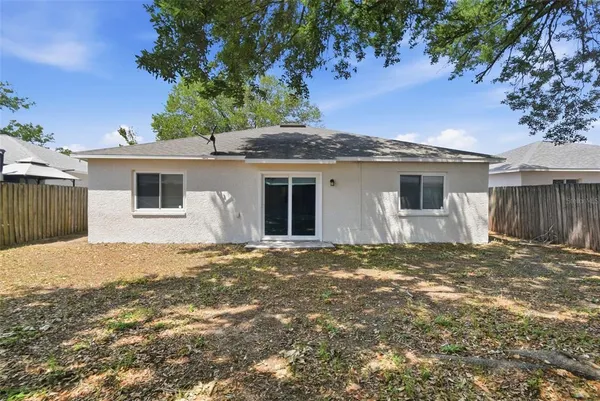 a house with a tree in front of it