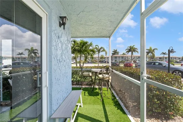 a balcony with chairs